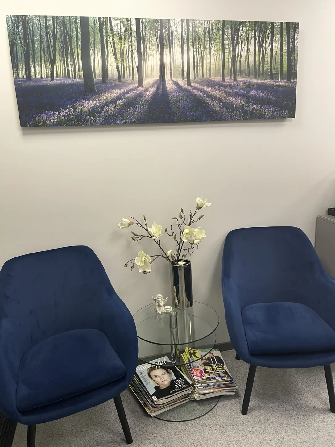 Salon waiting area with blue chairs